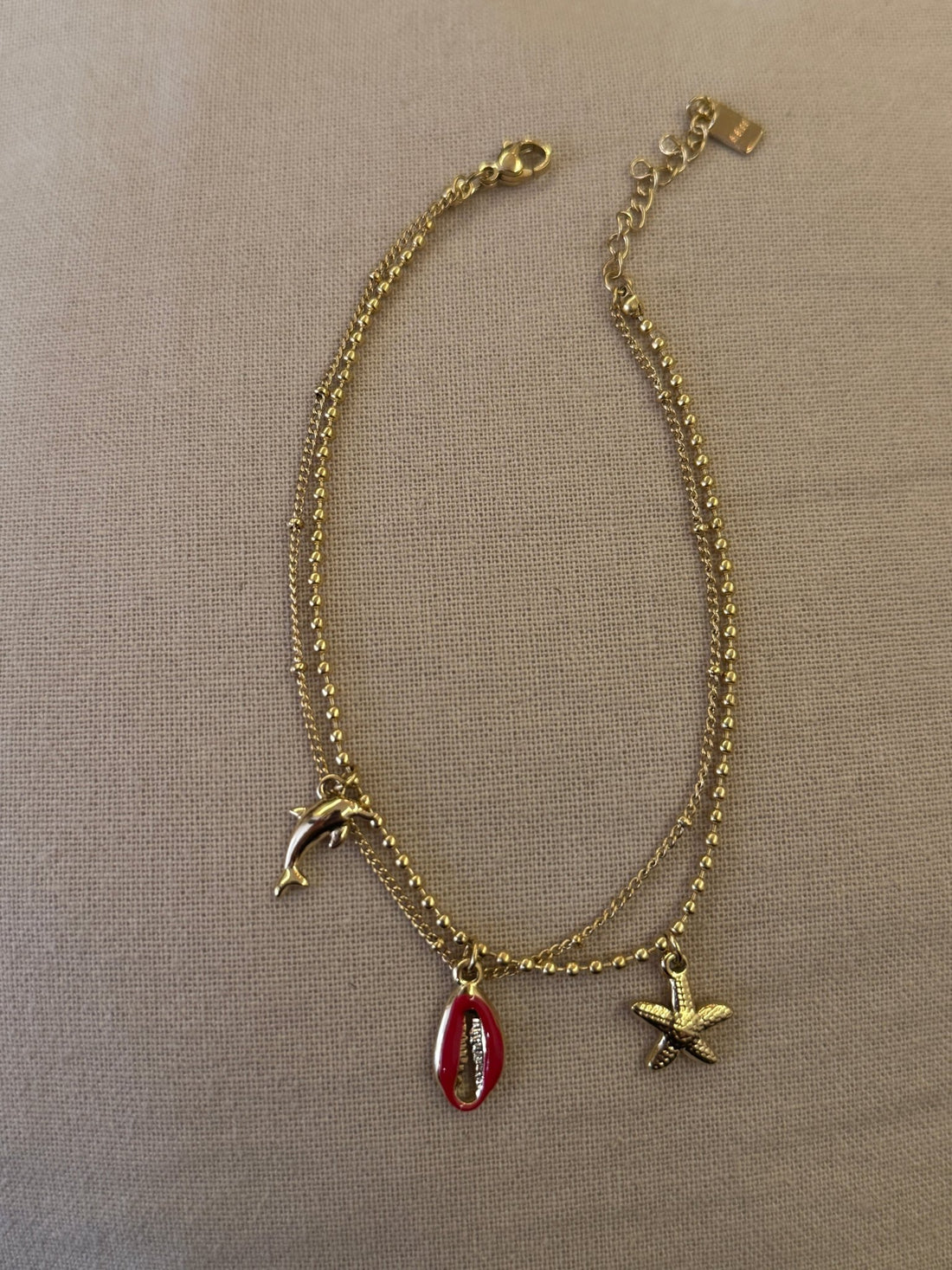 Chaîne de cheville double avec breloques rouges et dorées - Léone